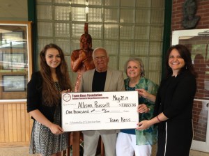 Kathleen's parents, Tom & Marty, and her sister, Krista, present the 2014 Memorial Scholarship Award to Miss Allison Russell, left.